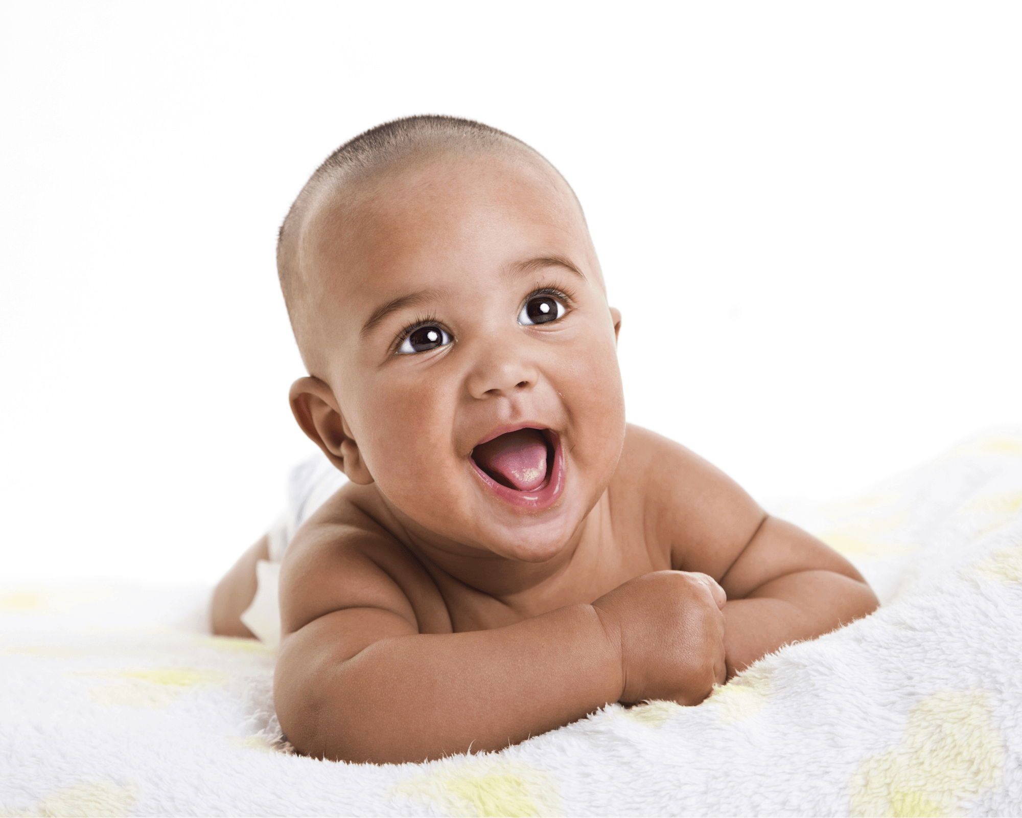 Baby boy lying on a white and yellow blankey.