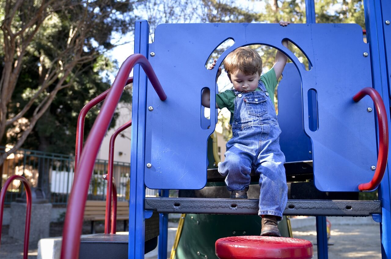 Boy playing on climber.