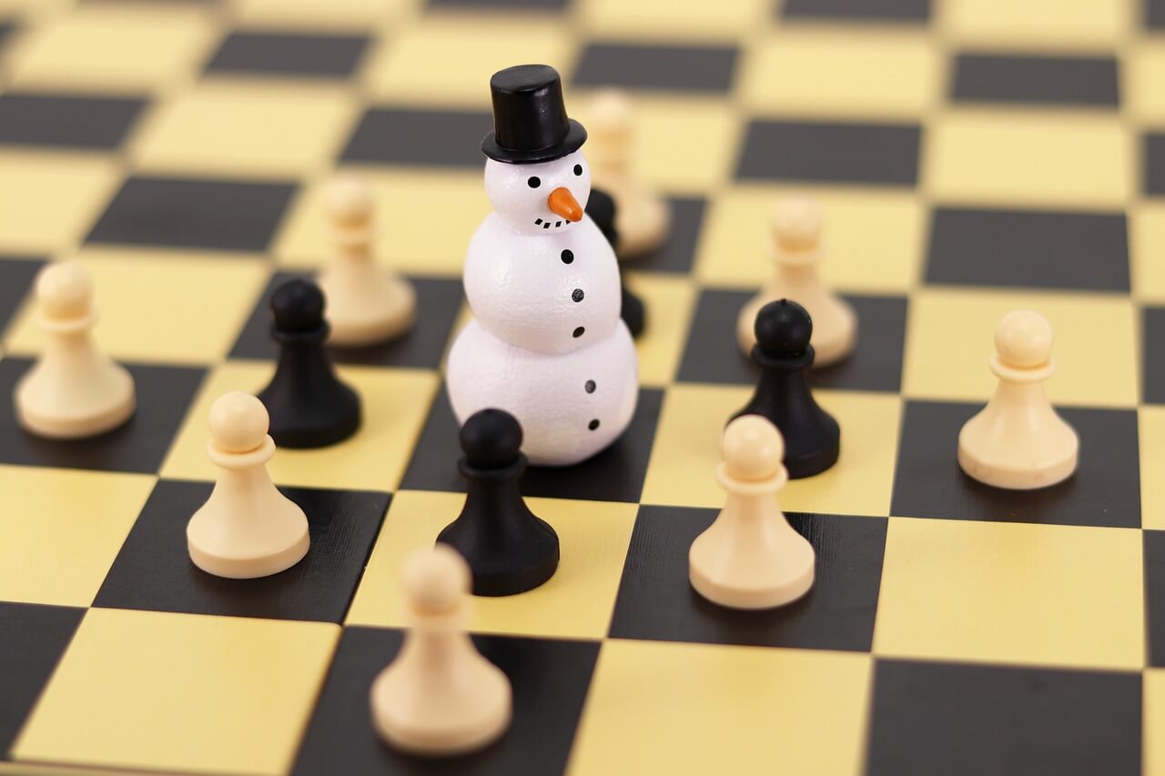 Checkerboard with Checker Pieces and Snowman