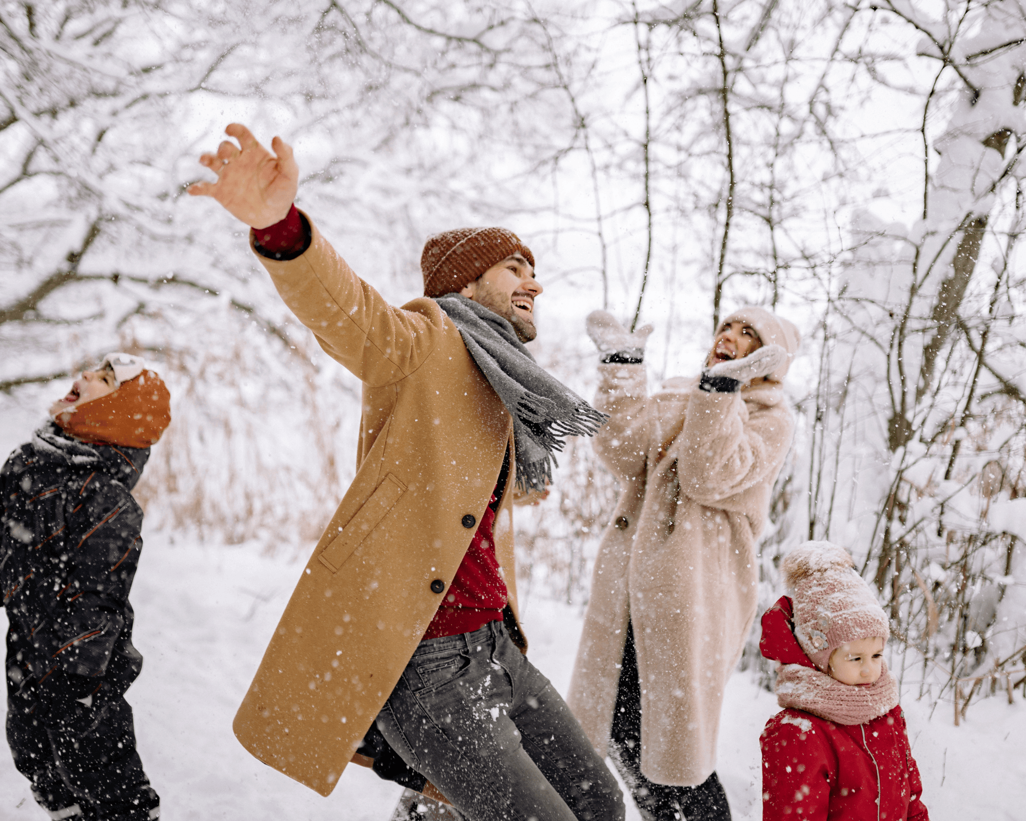 Family playing in the snow.