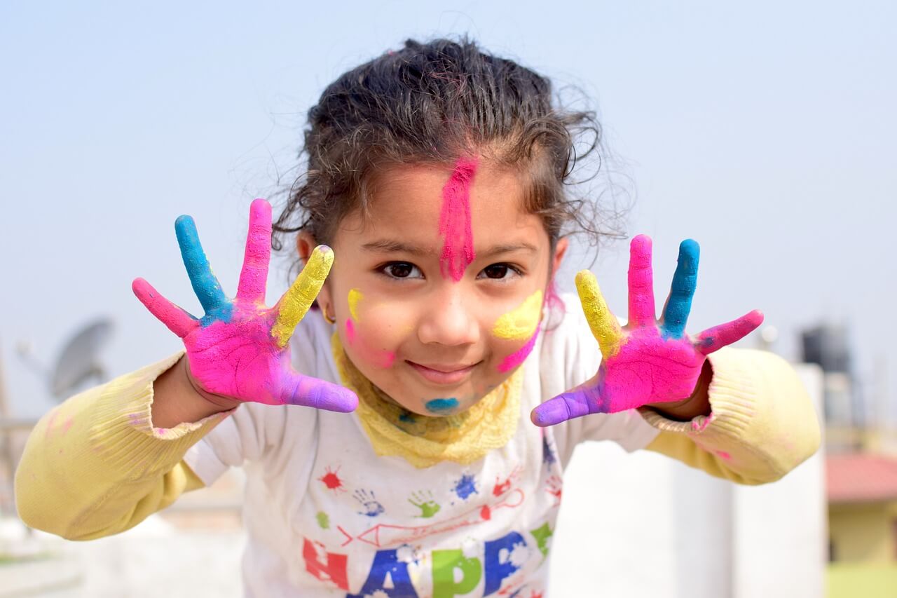 Young Girl fingerpainting. 