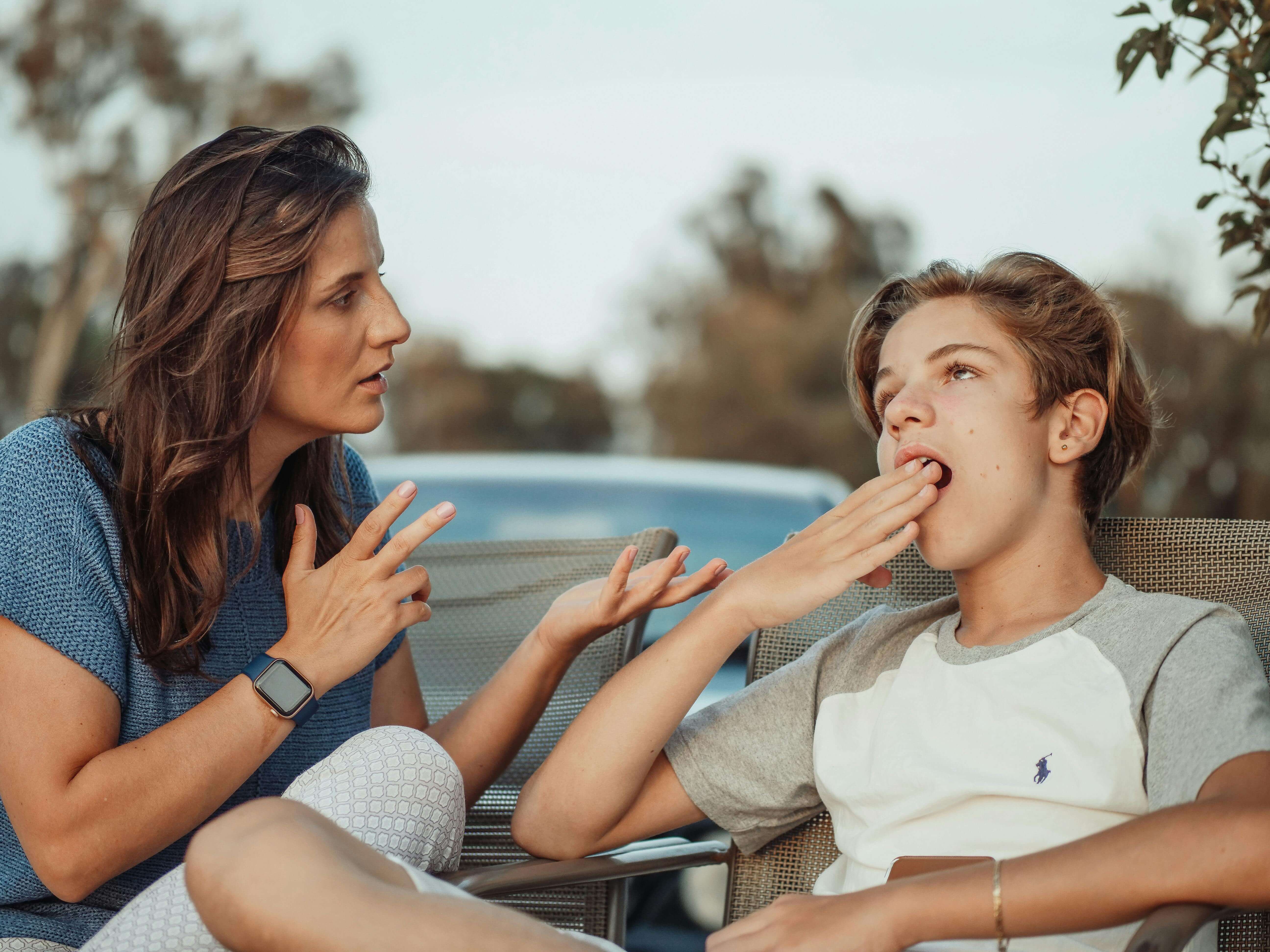 Kid Yawning While Mom is Trying to Talk About Something