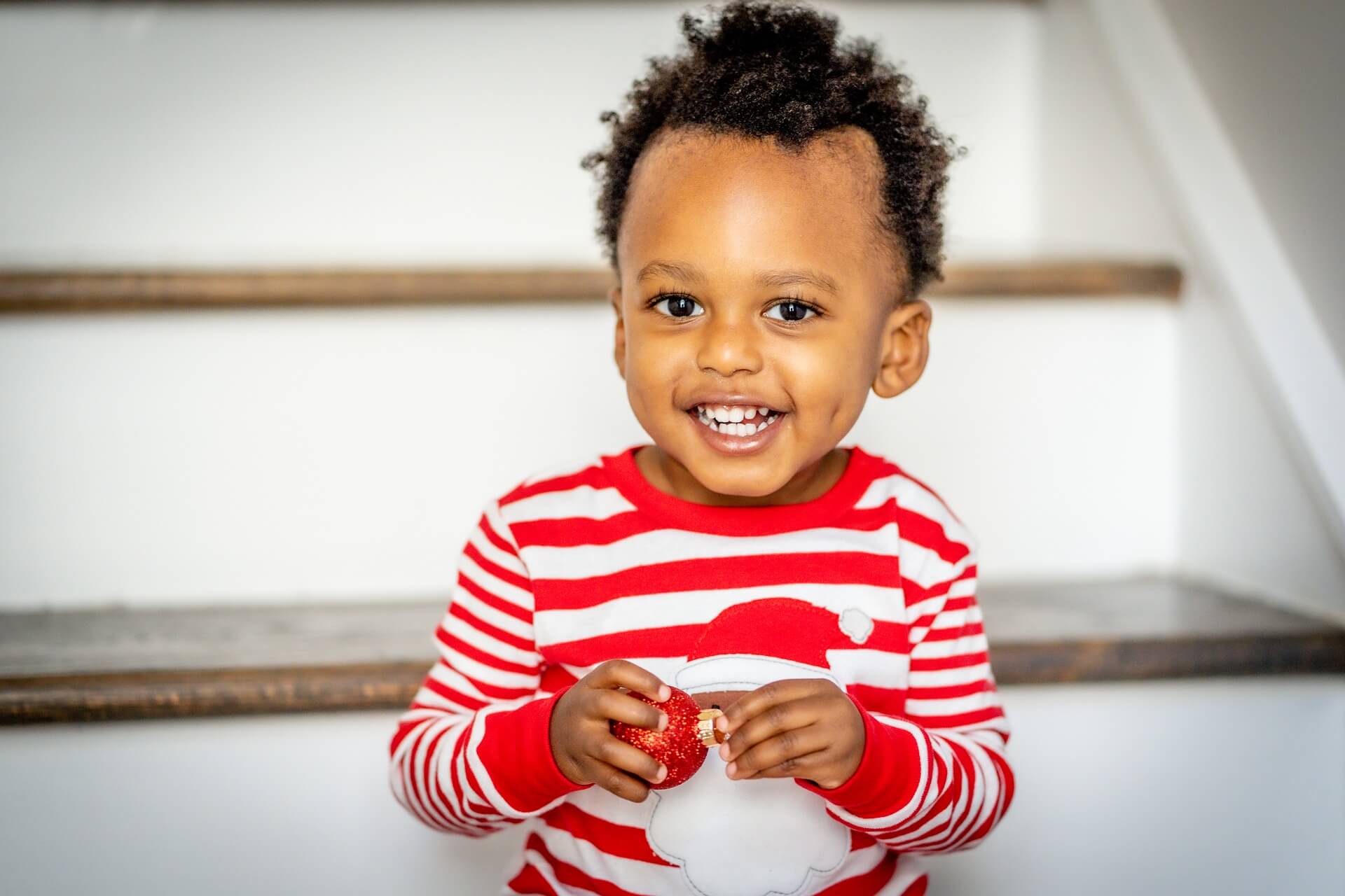 Toddler Sitting on Stairs with Beautiful Smile