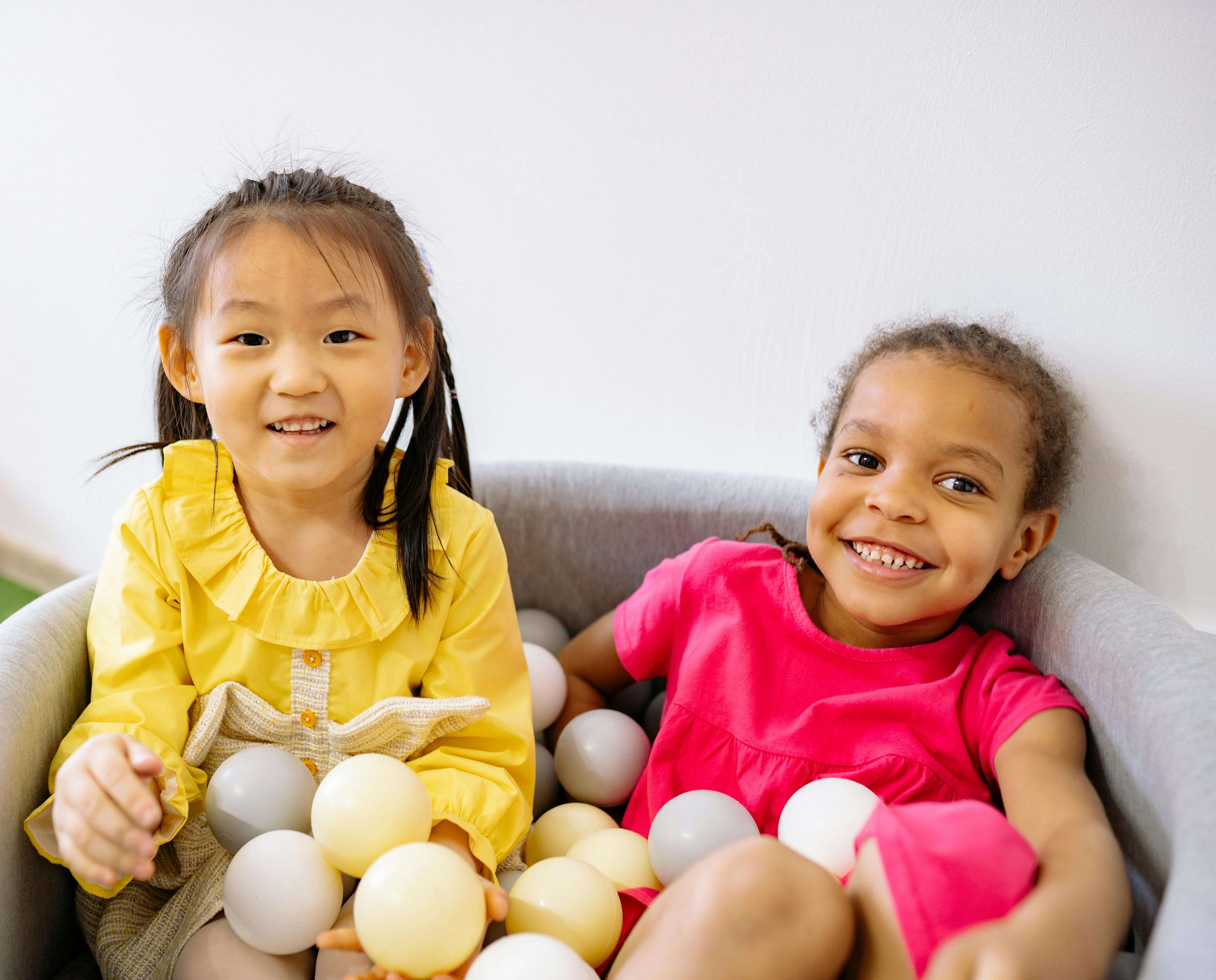 Prescoolers in small ball pit.