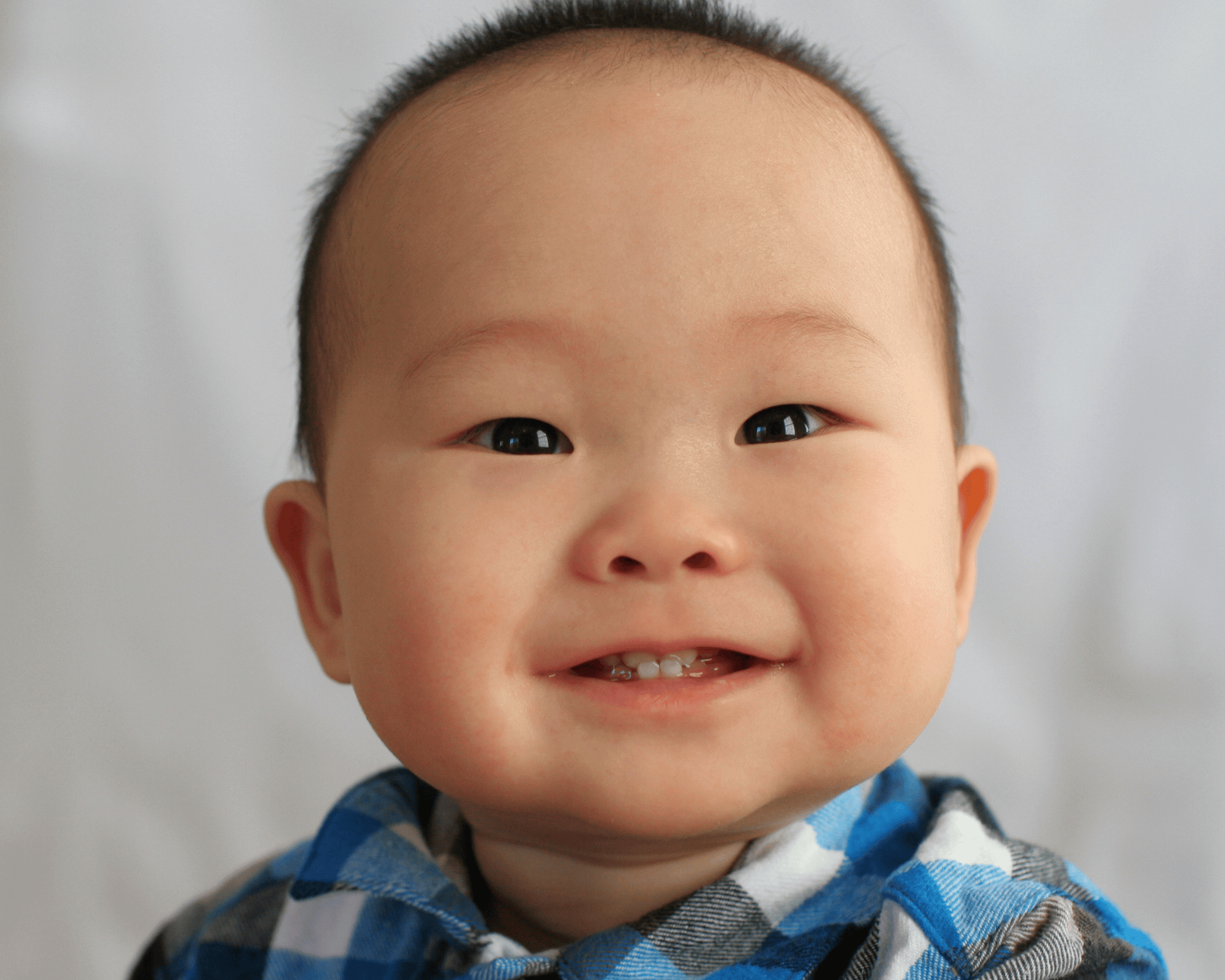 Baby boy with a huge smile.