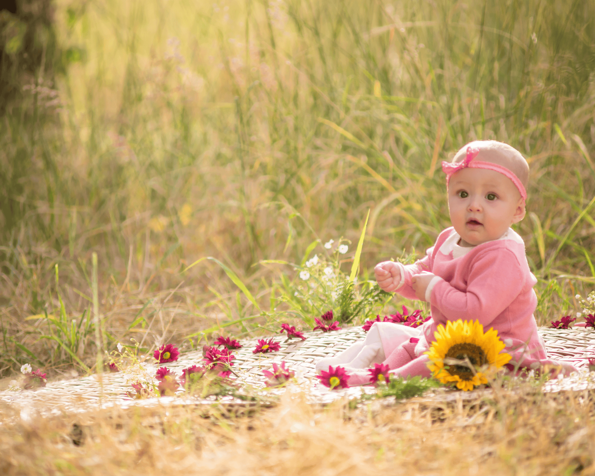 Baby girl having picnic outside.