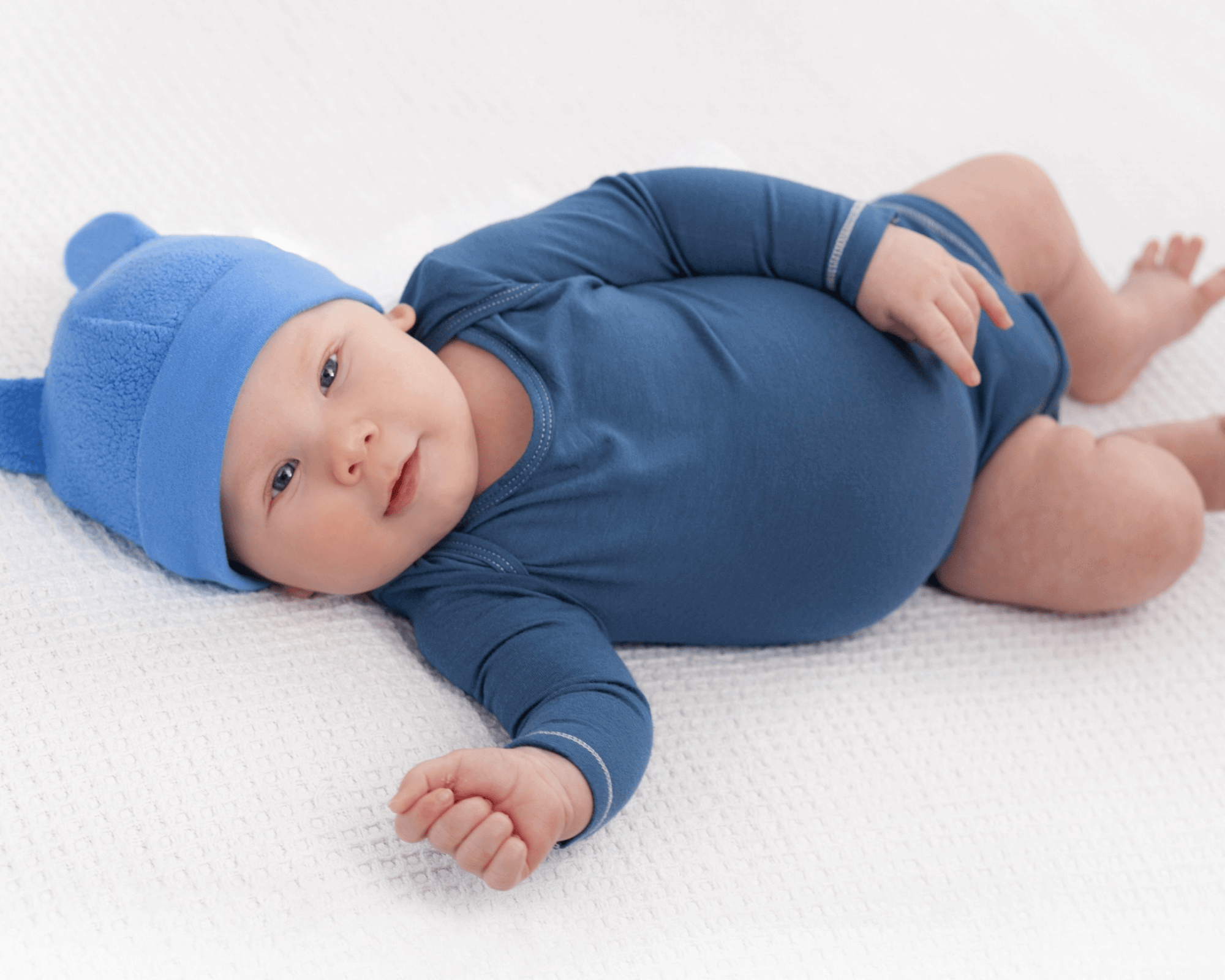 Baby boy wearing blue sleeper