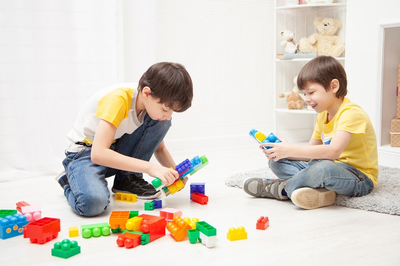 boys playing pretend with blocks